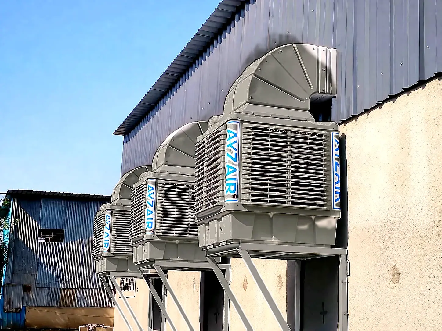 Ayzair industrial air coolers installed on a factory building in Pune